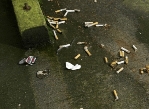 cigarettes and trash on the ground